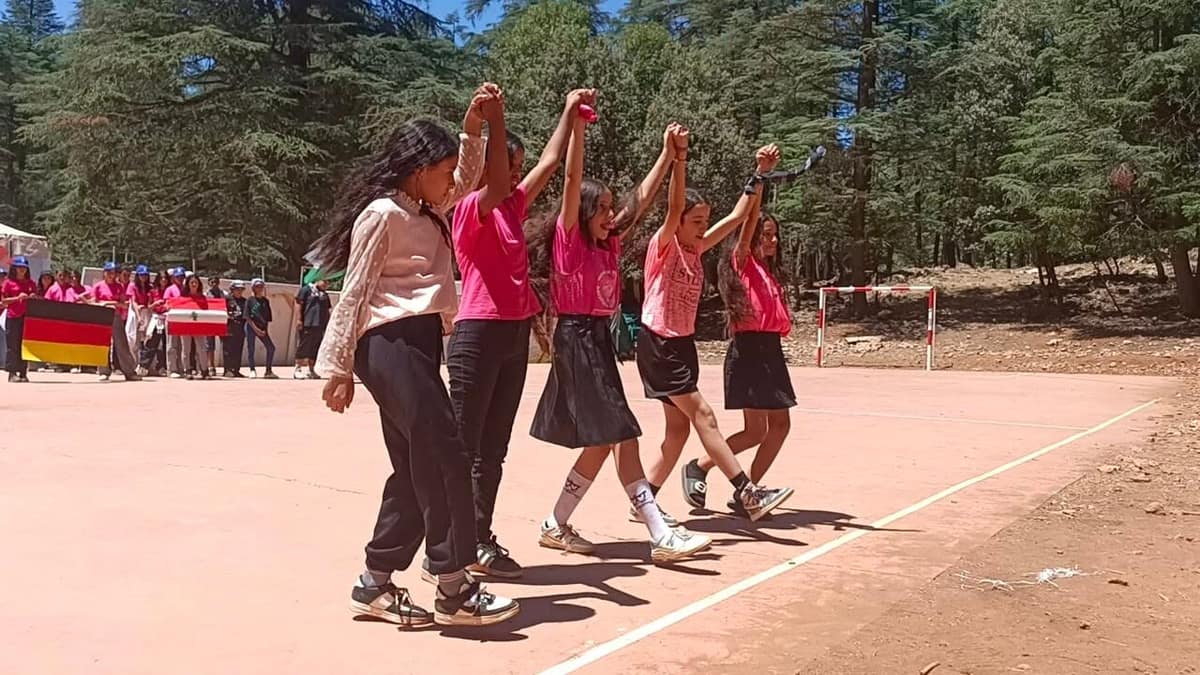 Young scouts taking part in camp games and shared activities.